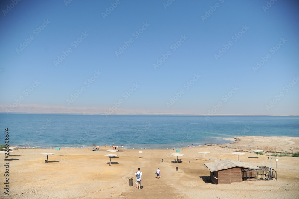 Dead Sea, Amman Beach,Jordan - September 28: vacationers and tourists bathe in the Dead Sea with Dead Sea mud in Amman Beach, Jordan Dead Sea, Amman Beach,Jordan - September 28: vacationers and tourists bathe in the Dead Sea with Dead Sea mud in Amman Beach, Jordan