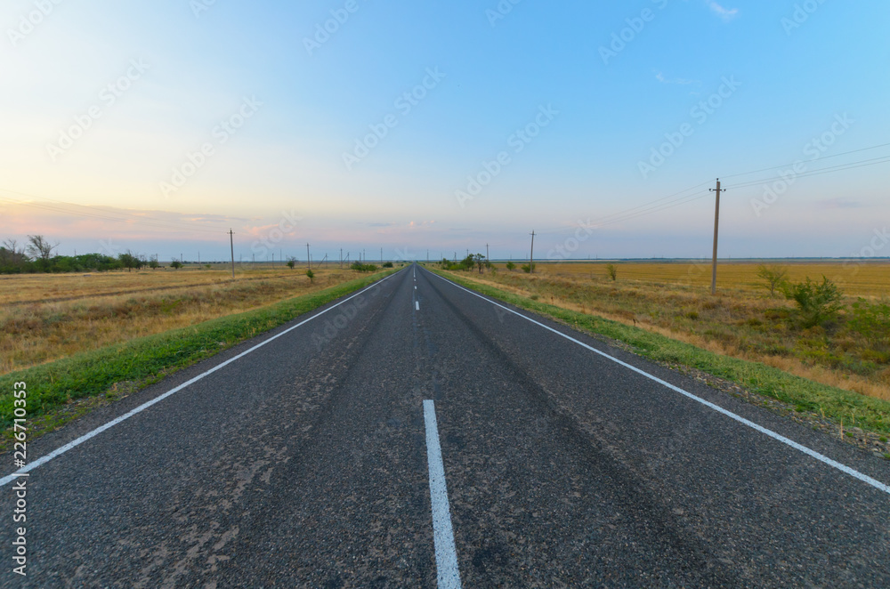 Paved road in the steppe.
