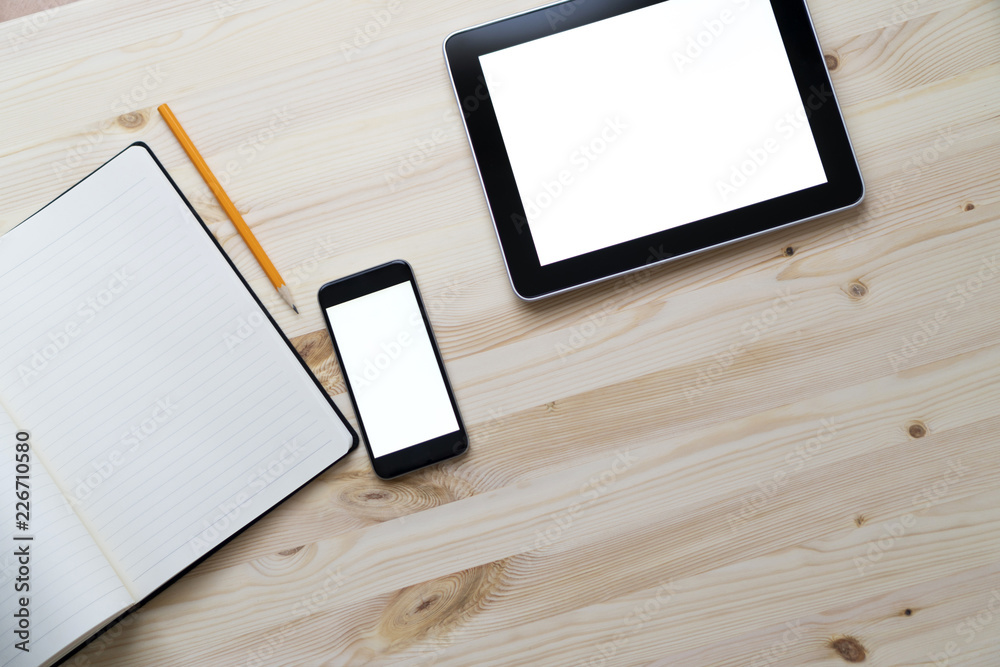 Knolling business desk top view with blank tablet and smartphone Knolling business desk top view with blank tablet and smartphone