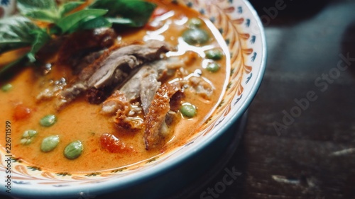 KAENG PHED PED YANG. Roasted Duck with pineapple,sweet basil leaves and chili peppers in red curry, Thai food style.