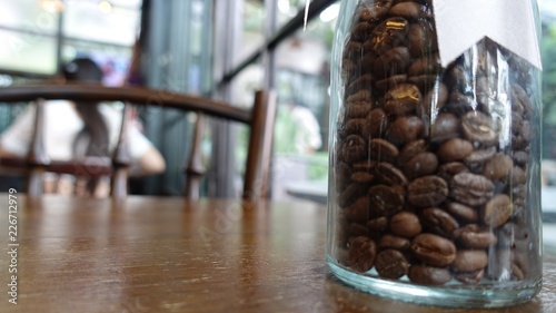 abstract image of a coffee seed in glass cafe and The atmosphere is happy and relaxing with bokeh for background