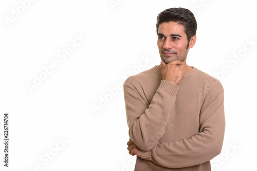 Young handsome Persian man against white background
