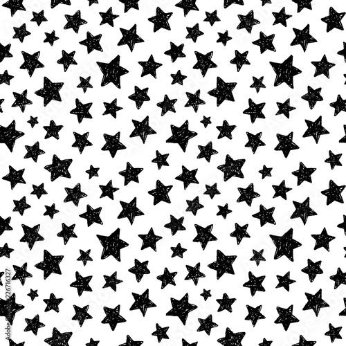 hand drawing black stars on a white background seamless pattern