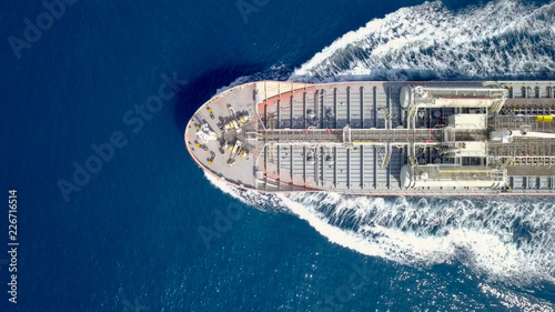 Fotografie Large crude oil tanker roaring across The Mediterranean sea - Aerial image