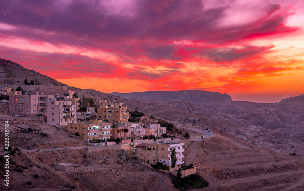 Wadi Musa, city of Petra in Jordan. Beautiful sunset over Wadi Musa, town  located in Ma'an Governorate in southern Jordan. It is the administrative  center of the archaeological site of Petra. Stock