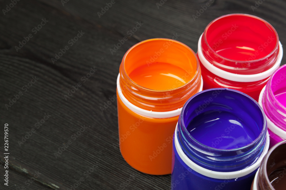 paint bottels on rustic wooden background paint bottels on rustic wooden background