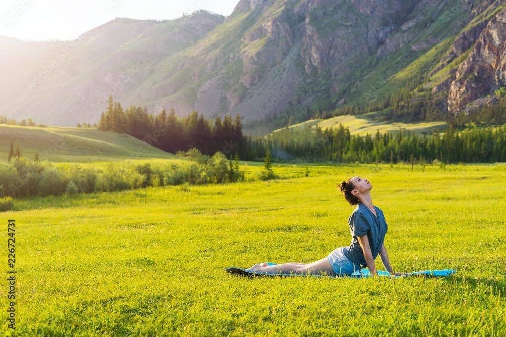 Girl doing fitness on the lawn