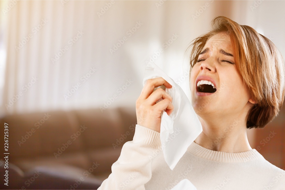 Young ill woman on blurred background Young ill woman on blurred background