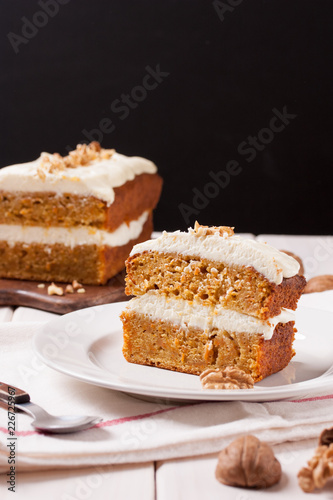Homemade carrot orange cake with cream cheese, traditional american afternoon tea treat.