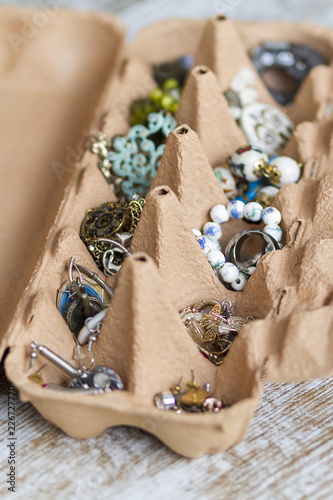 An egg box recycled as organizer for jewelry