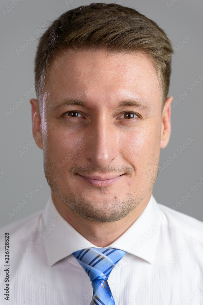 Handsome Caucasian man isolated against white background Handsome Caucasian man isolated against white background
