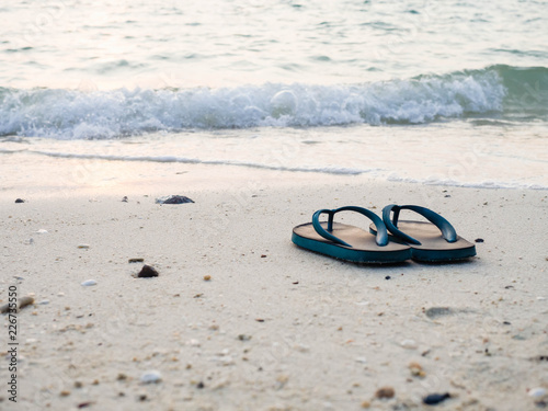 Relaxing sandals on beach