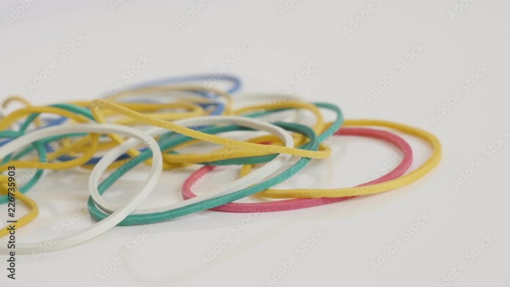 Colorful ring shaped rubber bands close-up 4K panning video Colorful ring shaped rubber bands close-up 4K panning video