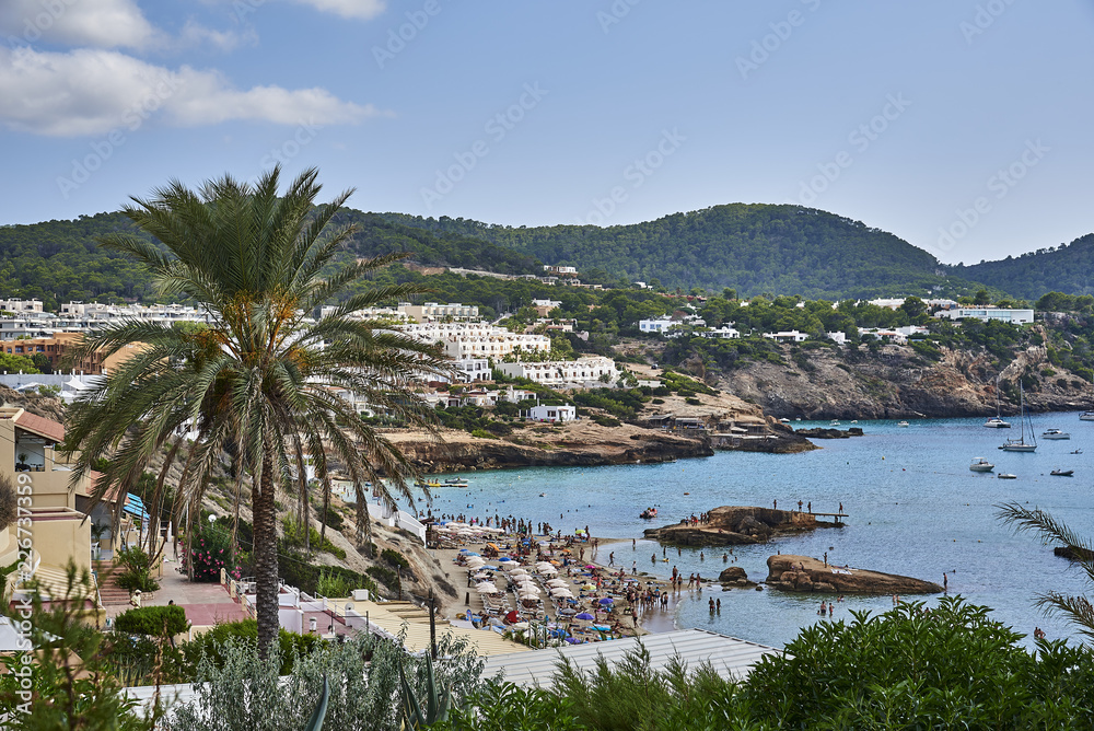 Paradise beach in Ibiza island with blue sky and crystal water