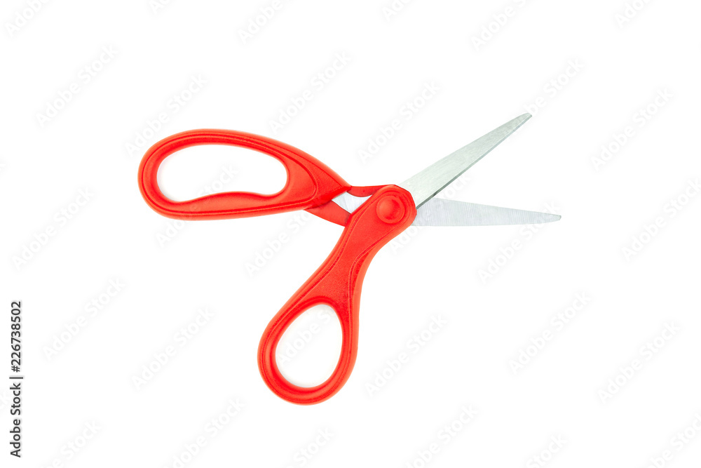 Scissors with plastic red handles isolated on white background , objects copy space Scissors with plastic red handles isolated on white background , objects copy space