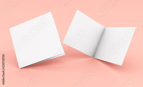 blank square bifold brochure on pink background