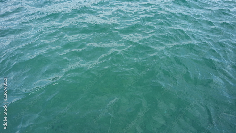 Calm lake water background clear small waves