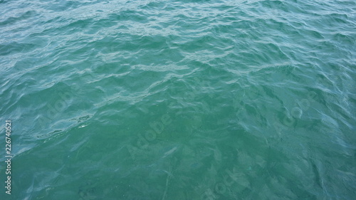 Calm lake water background clear small waves