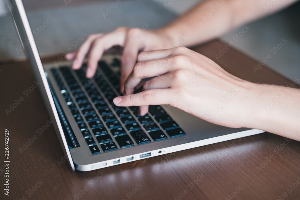 Female student's hands using laptop for work or study or shopping from home. Freelance concept. Horizontal. Female student's hands using laptop for work or study or shopping from home. Freelance concept. Horizontal.