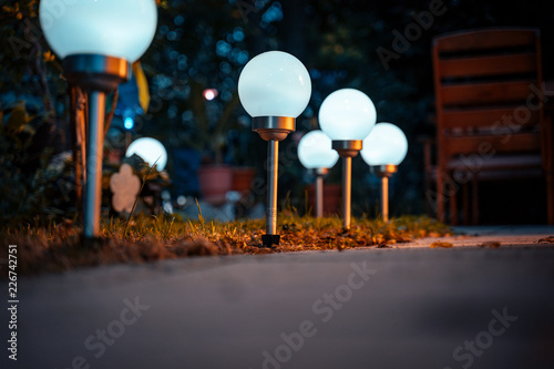 Solar lamps in the garden photo