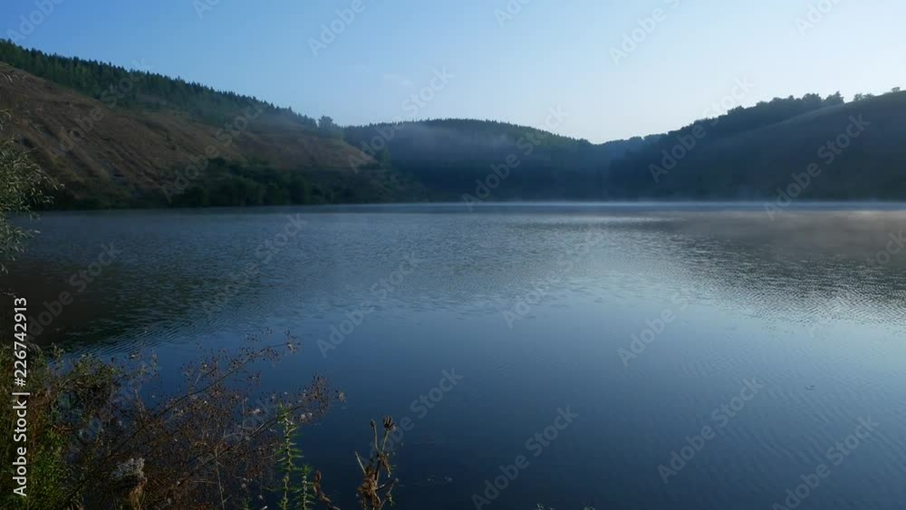 Fog spreads over the water.
Panorama (from left to right) over the fog which floats over the river on background of the forest. Fog spreads over the water.
Panorama (from left to right) over the fog which floats over the river on background of the forest.
