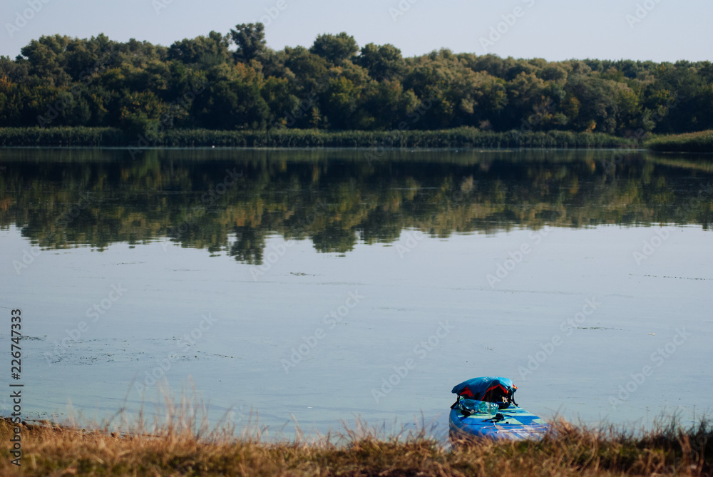 Obraz premium paddle Board on the river, water travel concept,