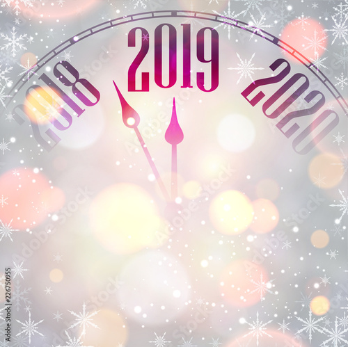 Blurred New Year 2019 card with clock and snowflakes.