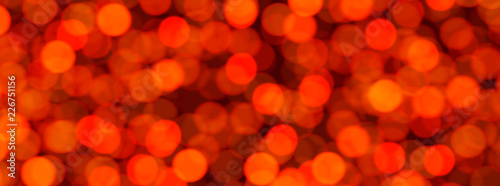 Red abstract festive banner with bokeh effect.