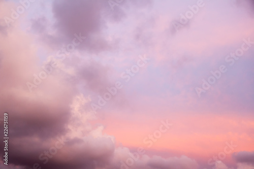 Beautiful natural background and texture, bright pink sunset sky with clouds.