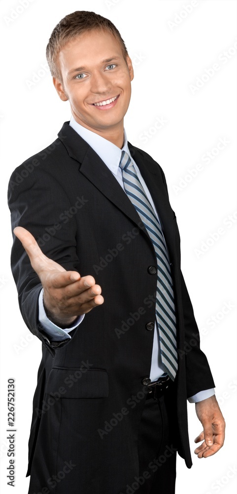 Professional looking man in a suit and tie extending his hand Professional looking man in a suit and tie extending his hand