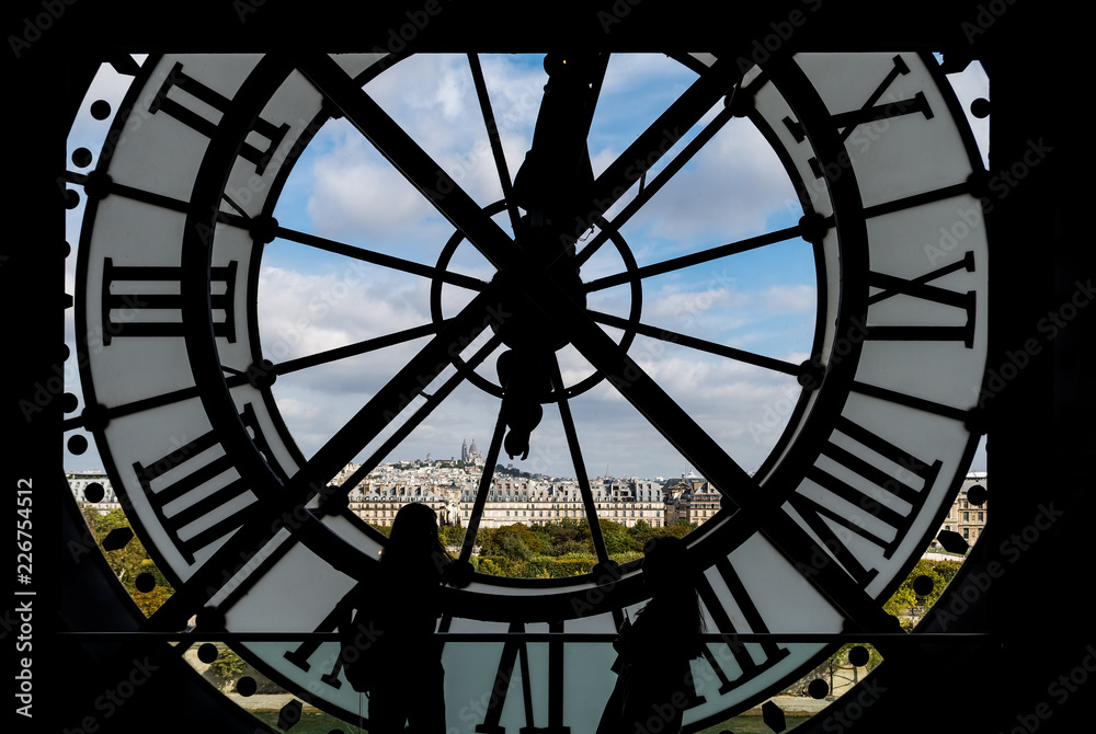 Musee d'Orsay visitors looking at Montmartre view through the giant glass clock - Paris, France