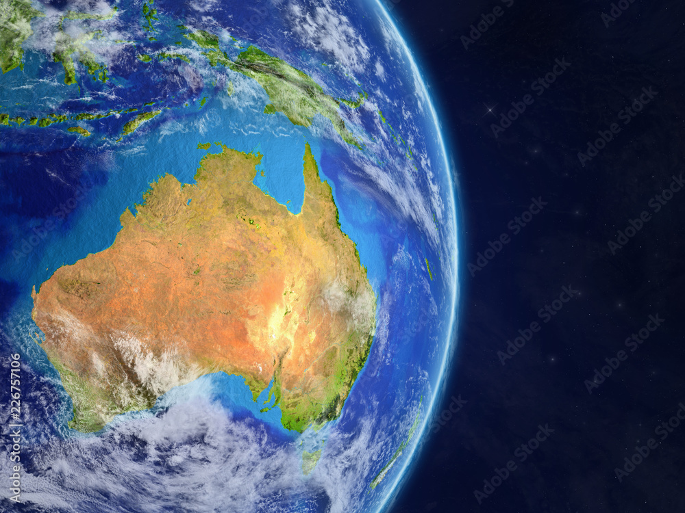 Australia from space on model of real planet Earth with highly detailed planet surface and clouds.