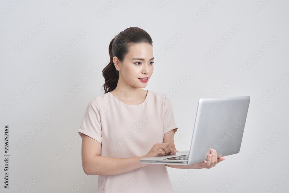 portrait of young asian businesswoman using laptop computer isolated on white background portrait of young asian businesswoman using laptop computer isolated on white background