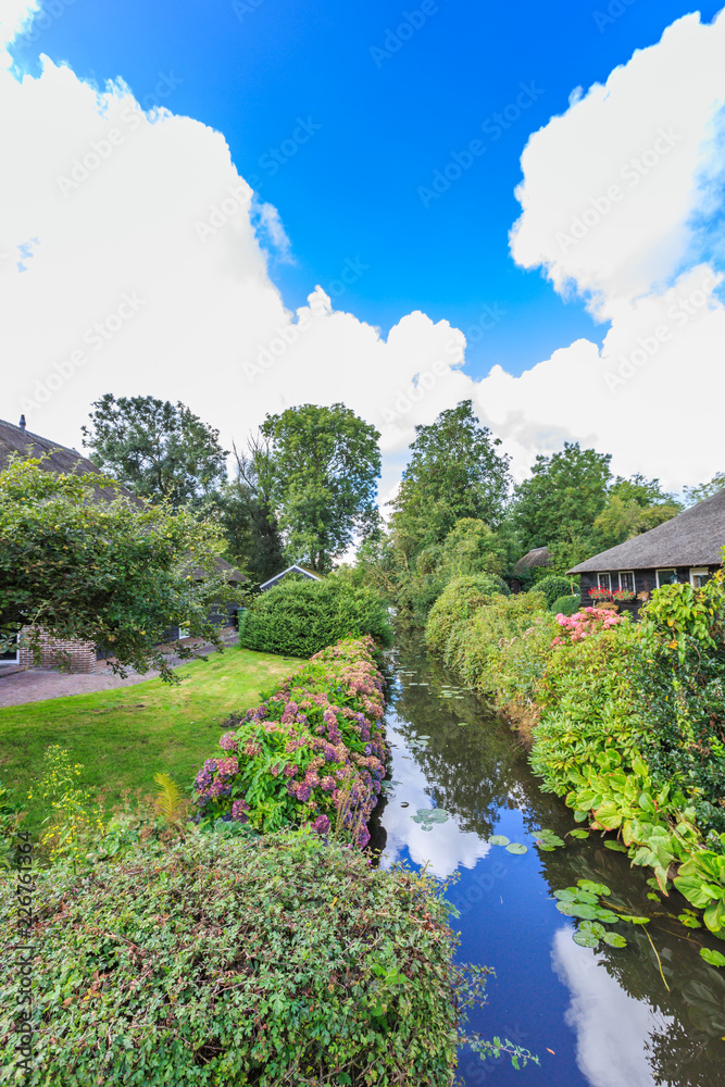 Fototapeta premium Noorderpad, Giethoorn, the Municipality Steenwijkerland, province of Overijssel, Netherlands, september 2, 2017: Rural houses village of Giethoorn in historical tourist wetland area