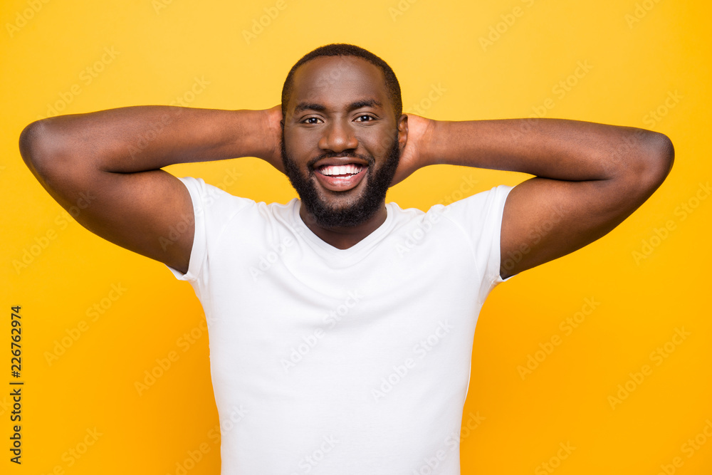 Handsome attractive manly cheerful mulato guy in white t-shirt w Handsome attractive manly cheerful mulato guy in white t-shirt w