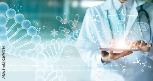 Foto Medicine doctor touching electronic medical record on tablet