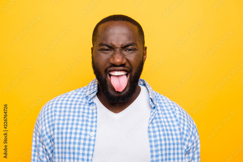 Close-up portrait of crazy mad unhappy mulato man in casual shir Close-up portrait of crazy mad unhappy mulato man in casual shir