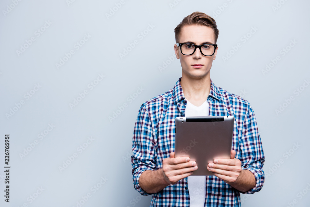 Portrait of cheerful man in checkered shirt look at camera stand