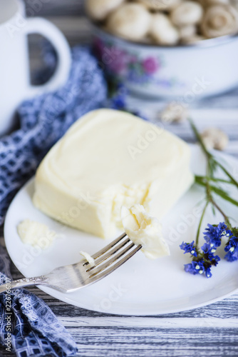 mozzarella cheese on a plate on a wooden background