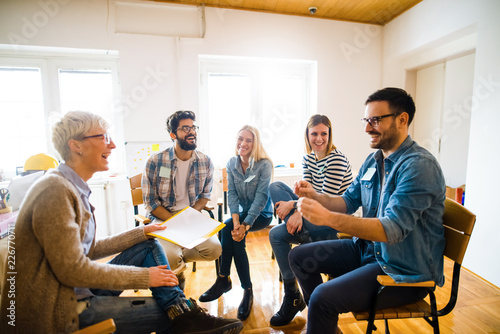 Photos Group of people sitting in a circle on group therapy