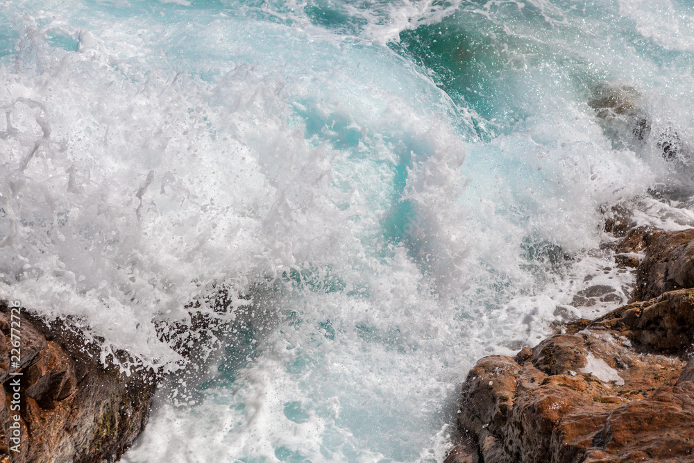 sea water splashing rocky coastline on the shores of Tossa De Mar