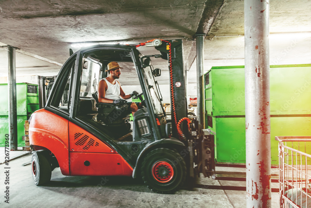 Warehouse man worker with forklift.