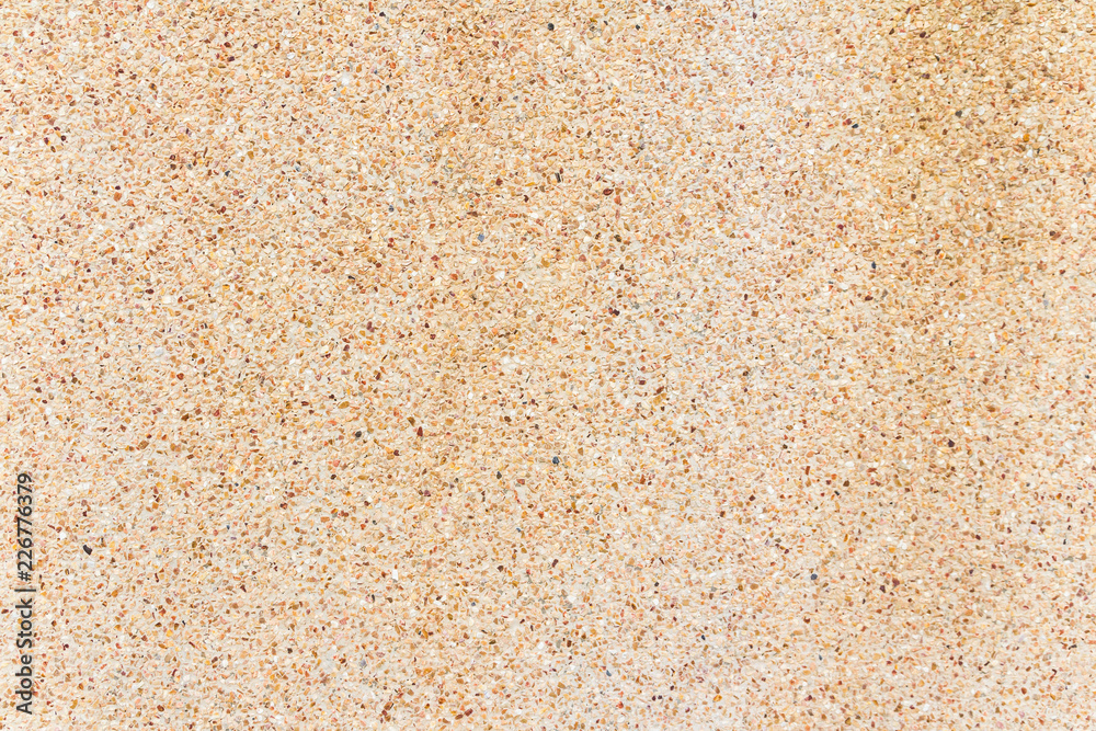 small stones wall or Pebbles and sand wall texture background
