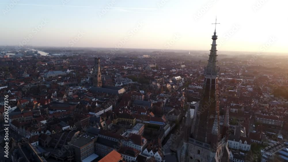 European city view from the top. Circle around steeple Church of Our Lady. Bruges, Belgium European city view from the top. Circle around steeple Church of Our Lady. Bruges, Belgium