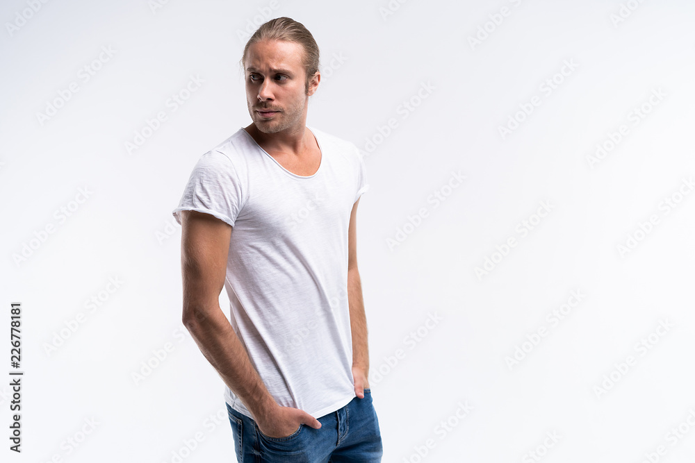 Handsome young guy posing in studio - isolated. Handsome young guy posing in studio - isolated.