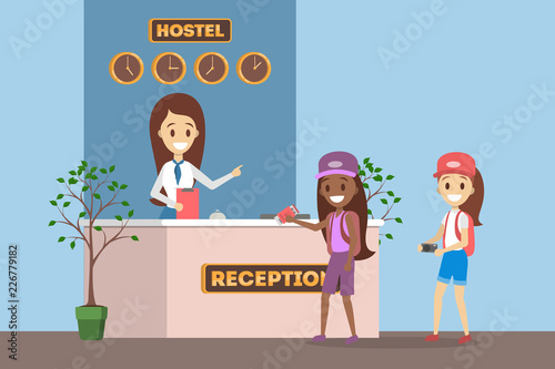 Children standing in queue at the hostel reception.