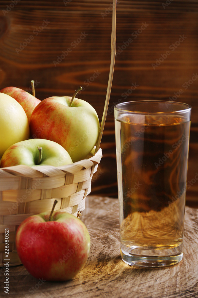 Apple cider in glass on wood background Apple cider in glass on wood background