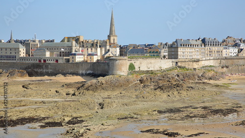 View of the walled city of Saint Malo from Grand Be Island at low tide, Saint Malo, Brittany, France