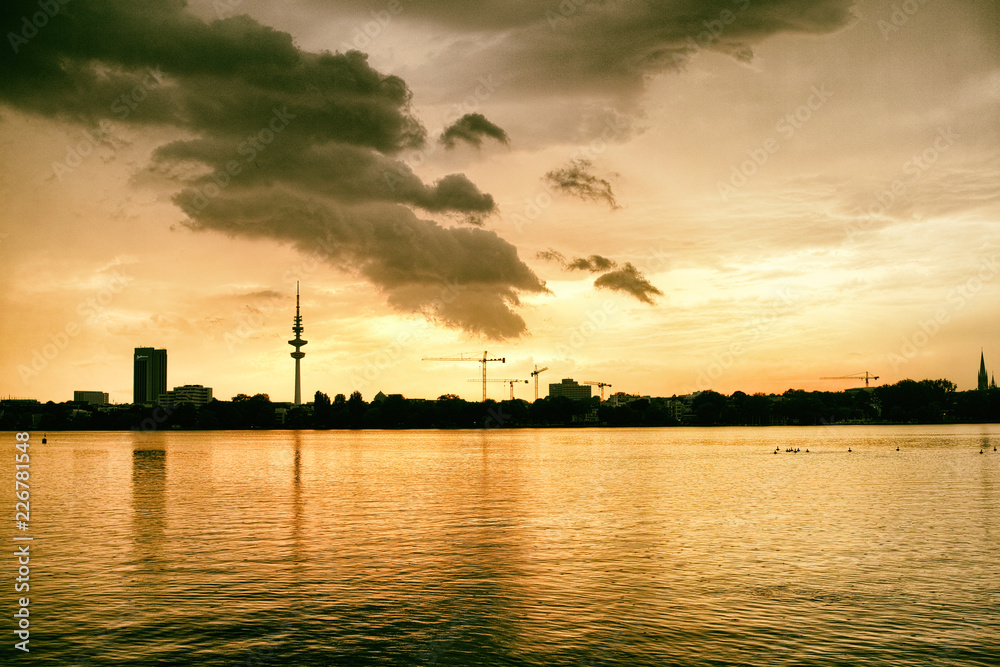 Alster Lake in Hamburg Germany View at beautiful and famous city park people rowing sailing panorama sky cloud Alster Lake in Hamburg Germany View at beautiful and famous city park people rowing sailing panorama sky cloud