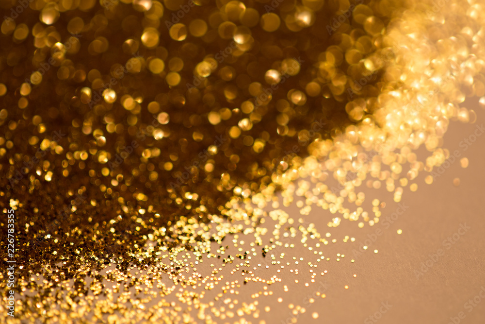 golden glitter bokeh texture with place for text: christmas, celebration, party, invitation abstract background